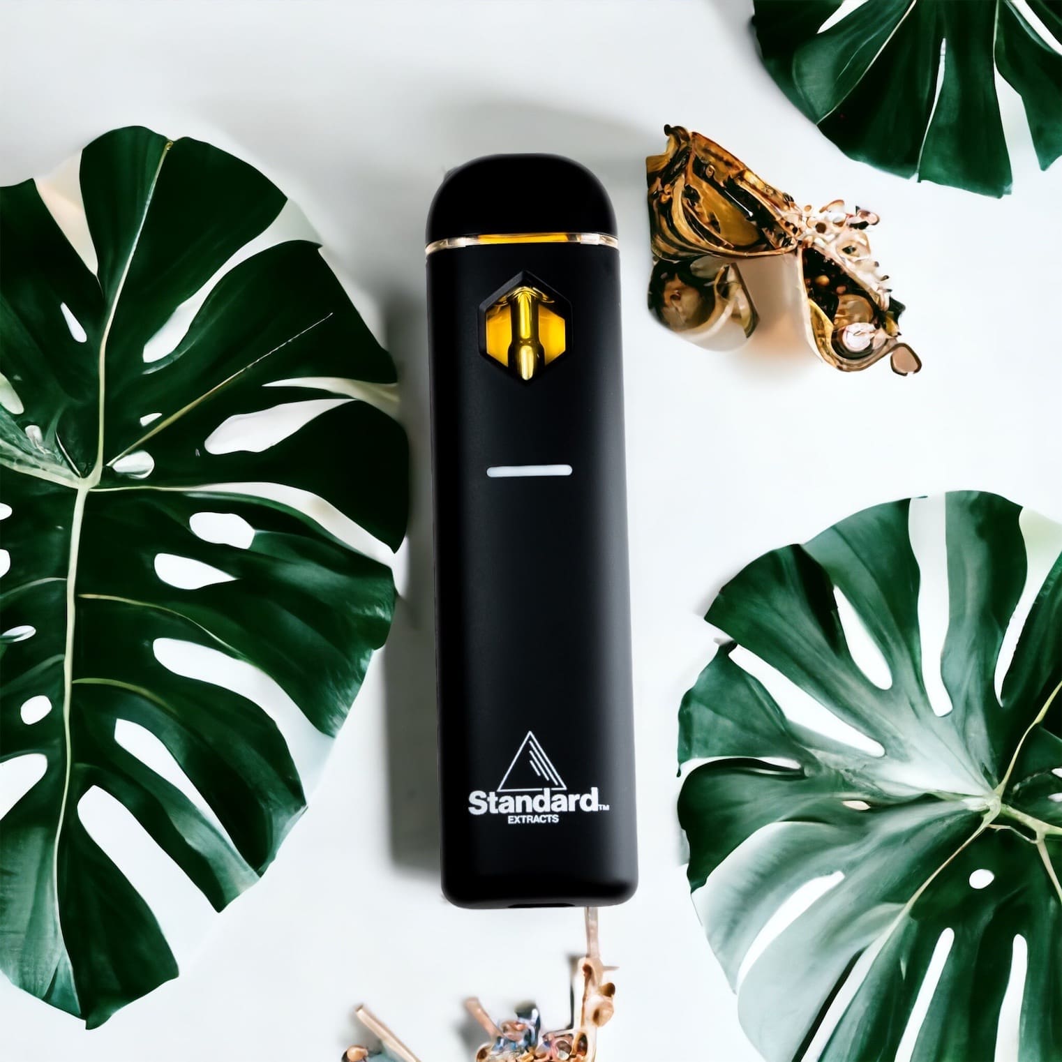 KO Blend Disposable Vape sits beside a green leaf