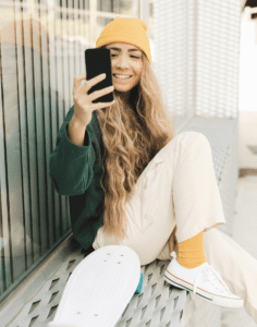 girl in skate board taking a selfie