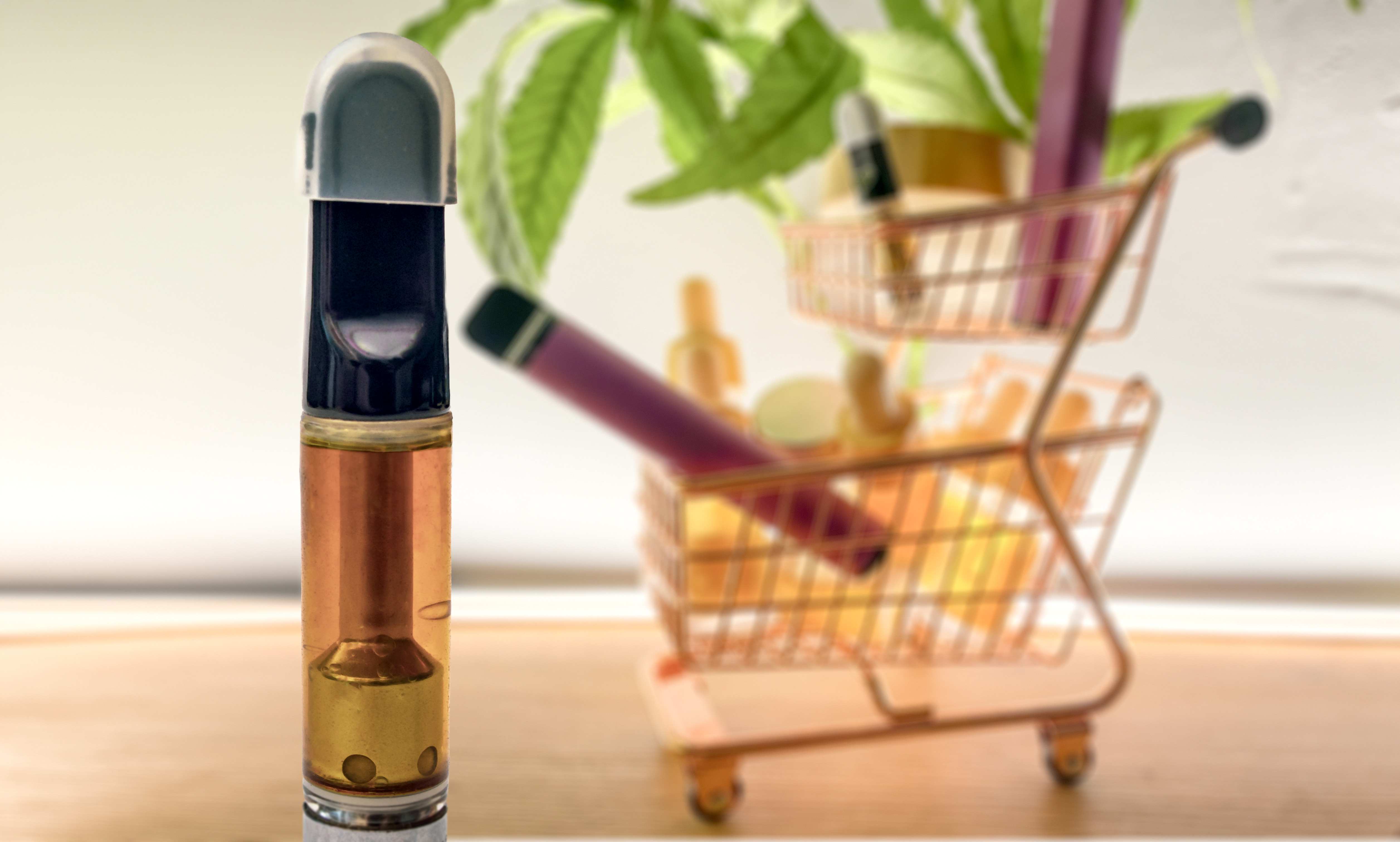 HHC CBD or THC vape cartridge and trolley with various Cannabis products